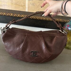 Authentic Chanel Brown Leather Hobo
Shoulder Bag with Silver-Tone Hardware